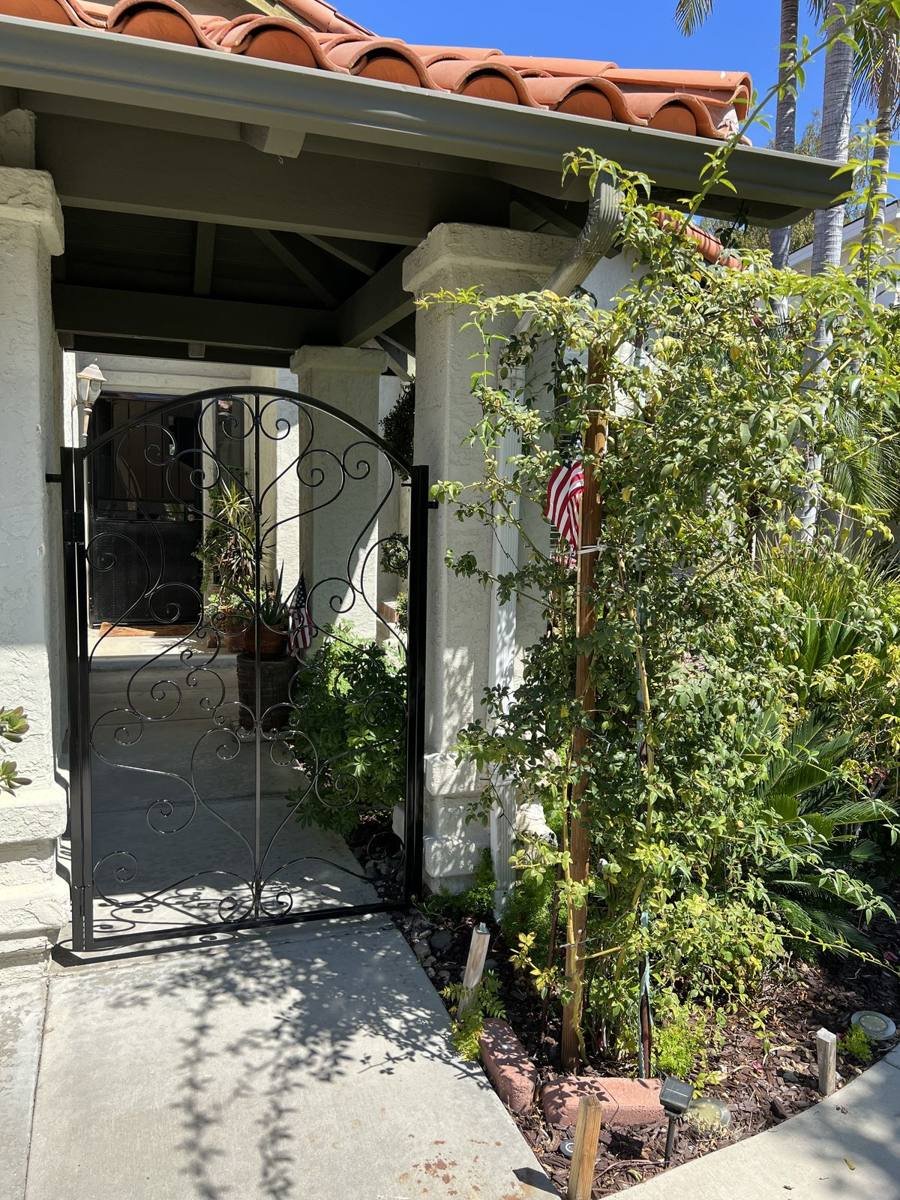 Arched scrollwork entry gate