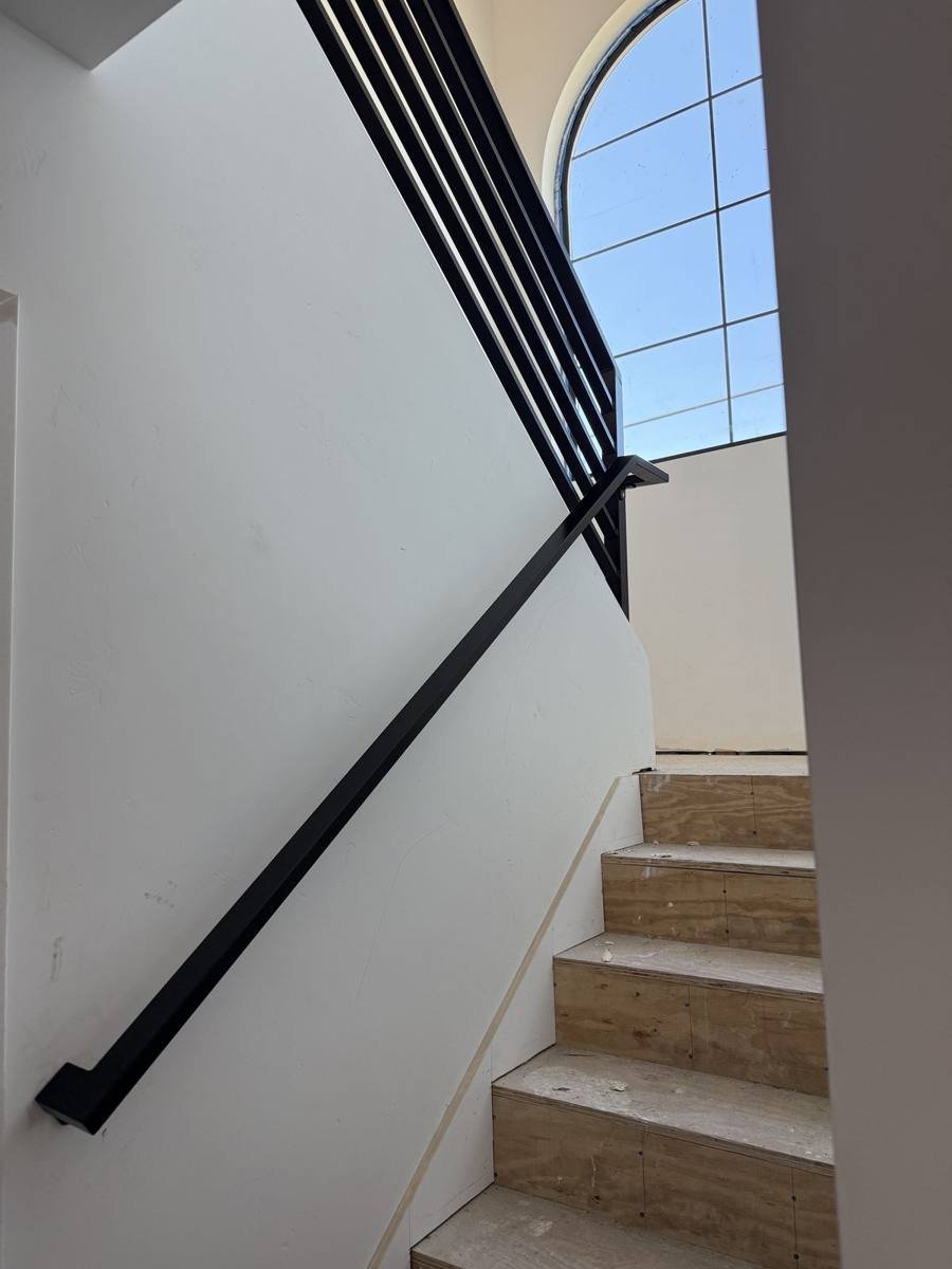 Interior stair handrail, view from the bottom